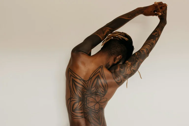 Blackwork back piece, arms raised