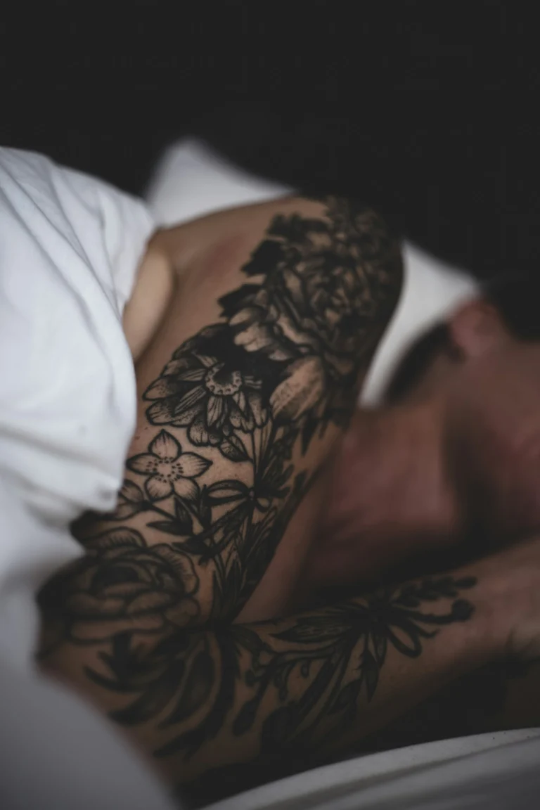 Black floral blackwork on an arm