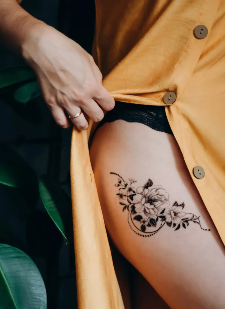 Black floral piece on the thigh
