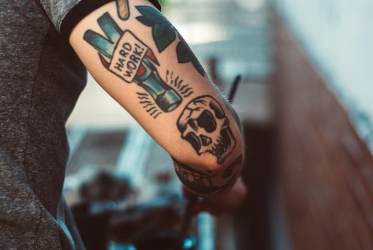 Illustrative skull and characters on a forearm
