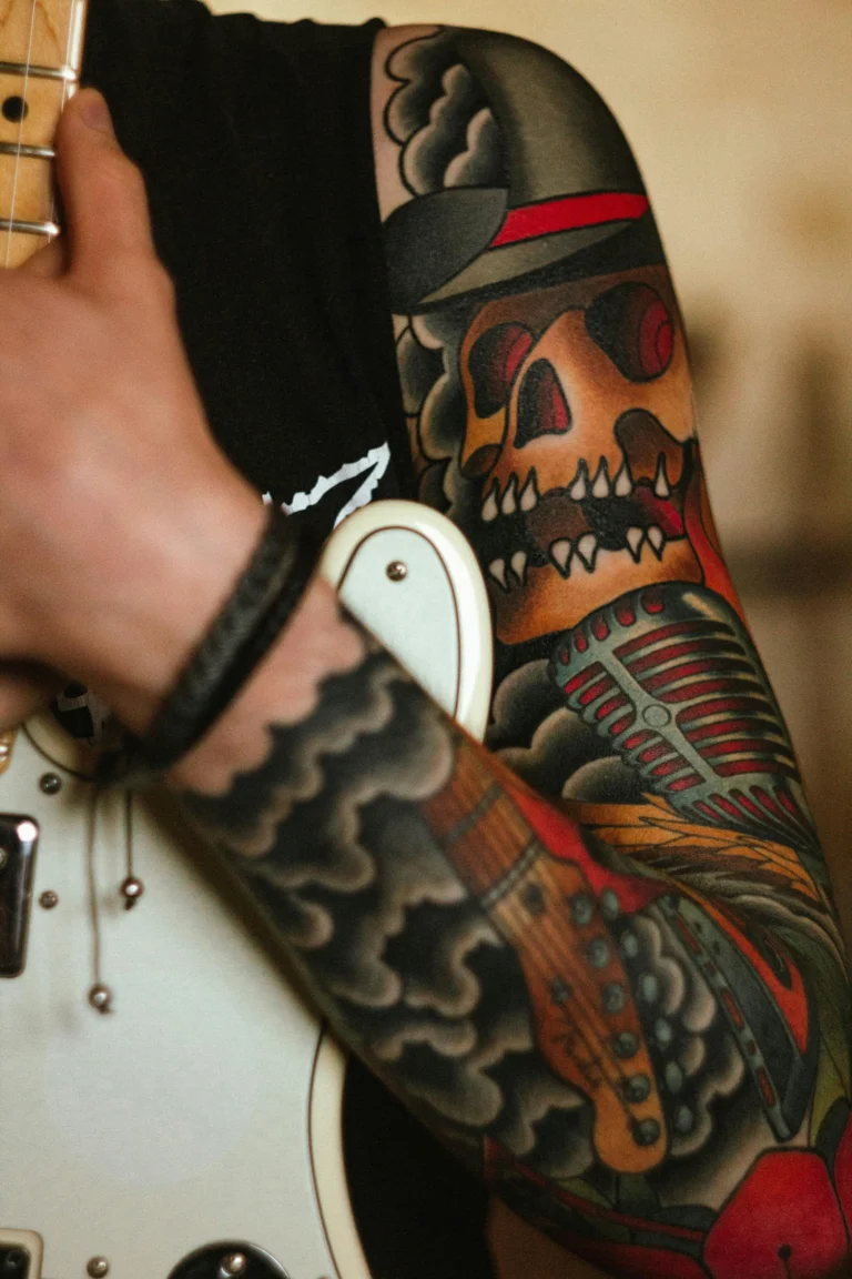 Illustrative sleeve on a guitarist’s arm