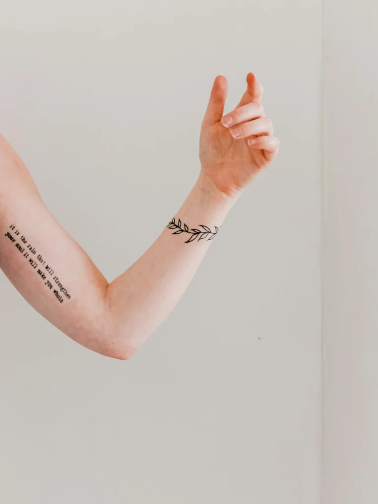 Fine script on the inner arm and wrist