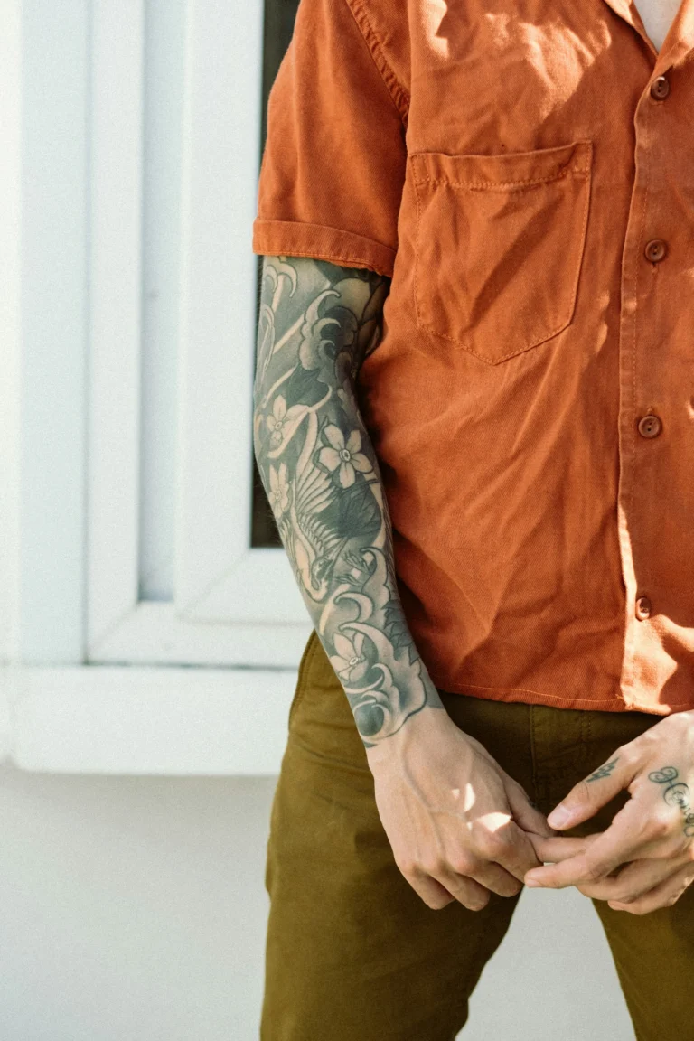 Black and grey half sleeve on a forearm